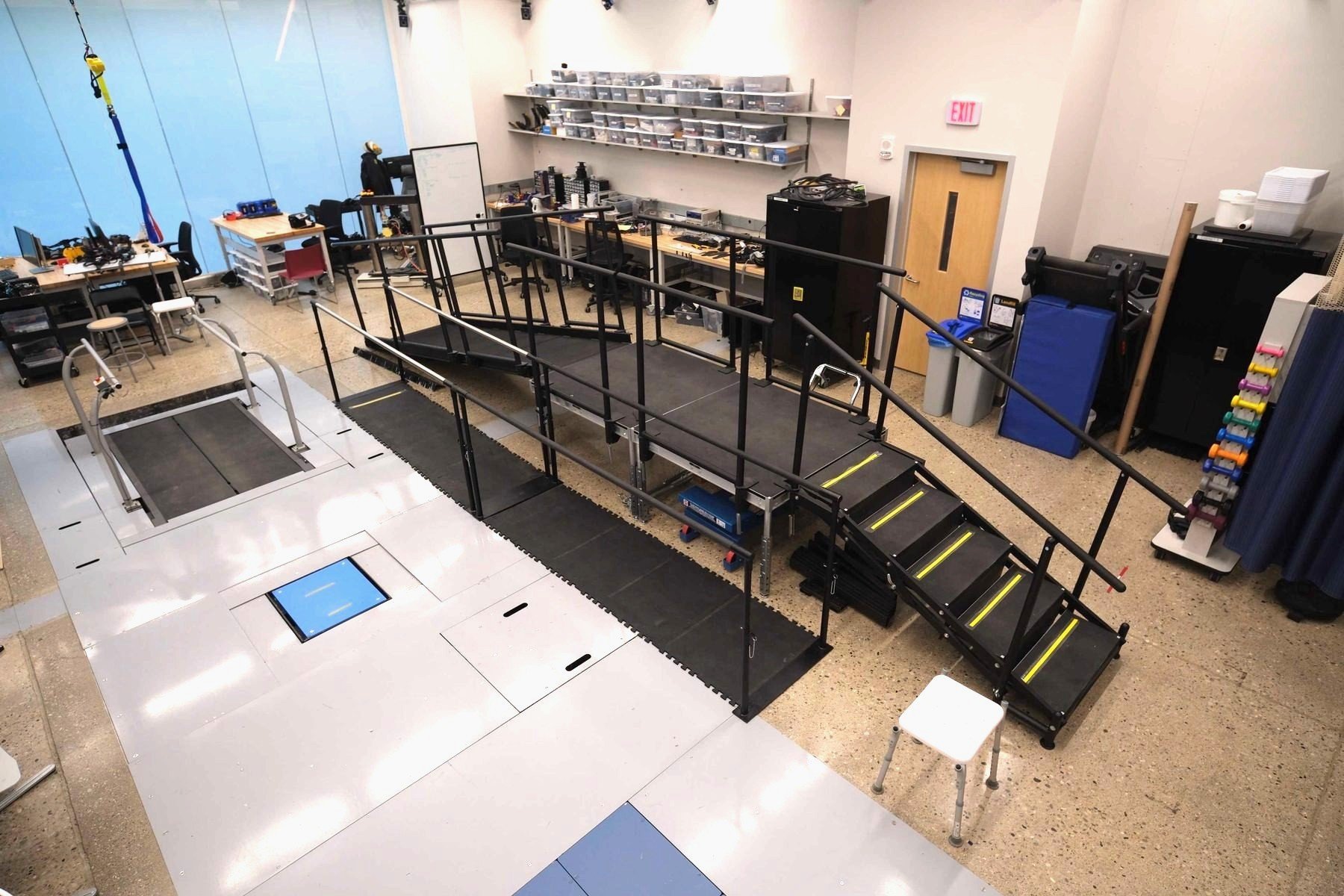 Ambulation circuit with a raised walkway, staircase, ramp, and instrumented floor panels.